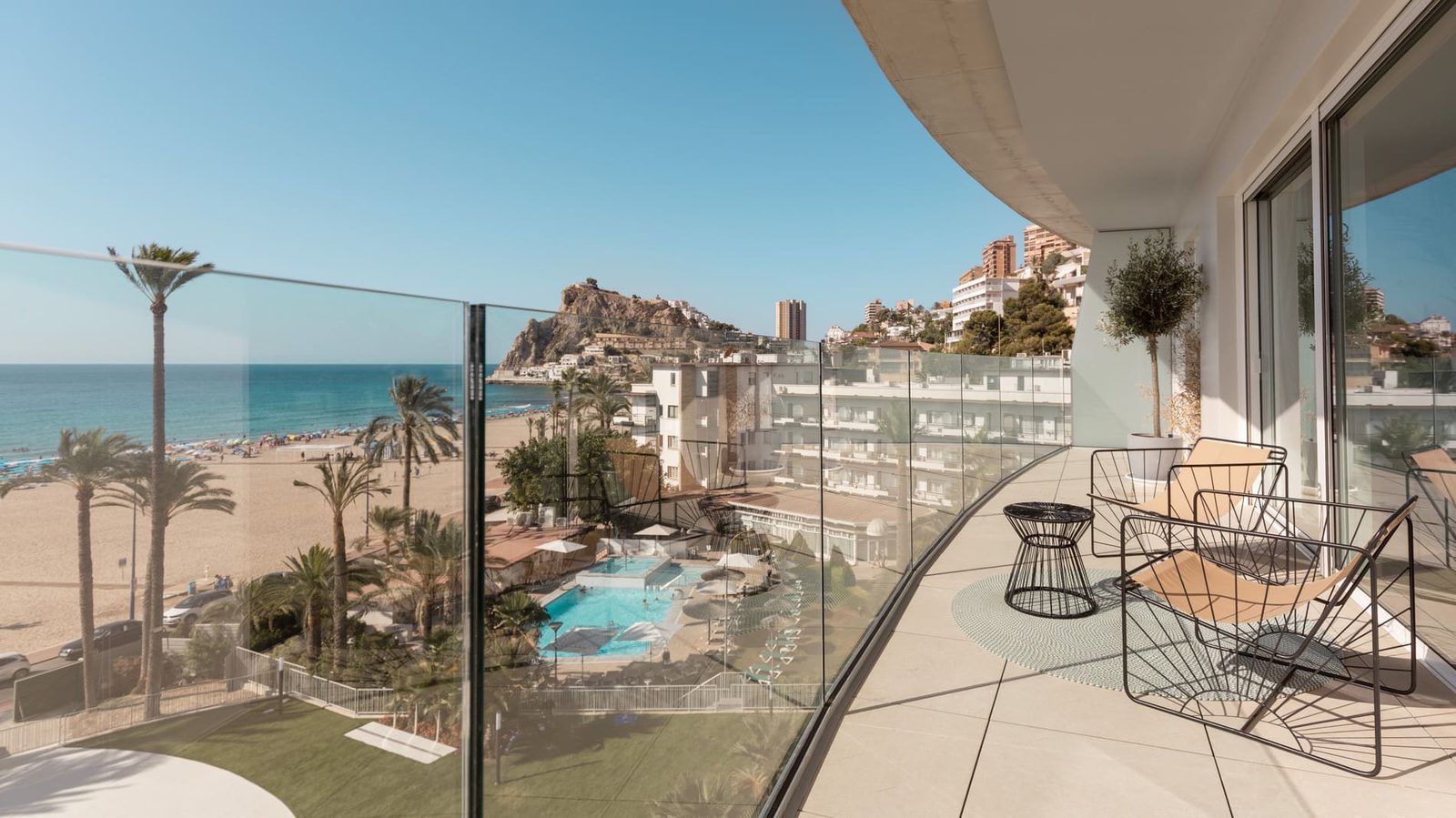 Sea-view balcony overlooking Poniente Beach, pool and Benidorm coastline of a 2-bedroom apartment in Benidorm - The Estates